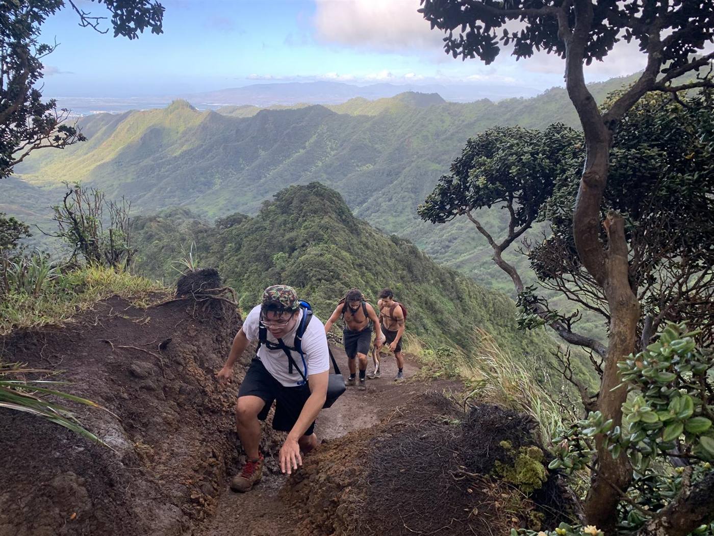 The group climbing the ridgeline above the valley.